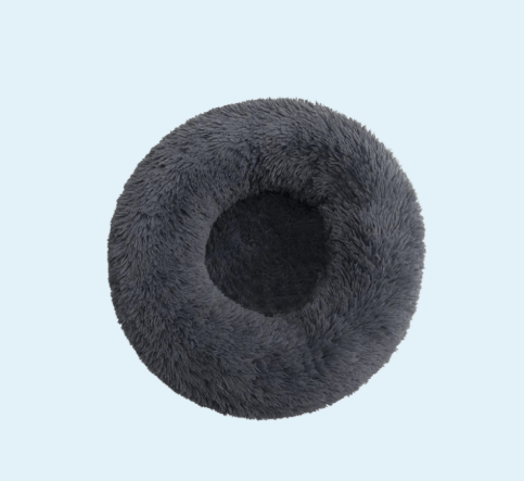 Calming Donut Bed for Pets โ Plush Dog & Cat Bed for Sleep in soft pink, round design supports anxiety relief and cozy rest for pets.